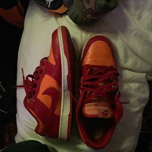 Nike dunks for sell size 9.5 good condition. Color red, dark yellow